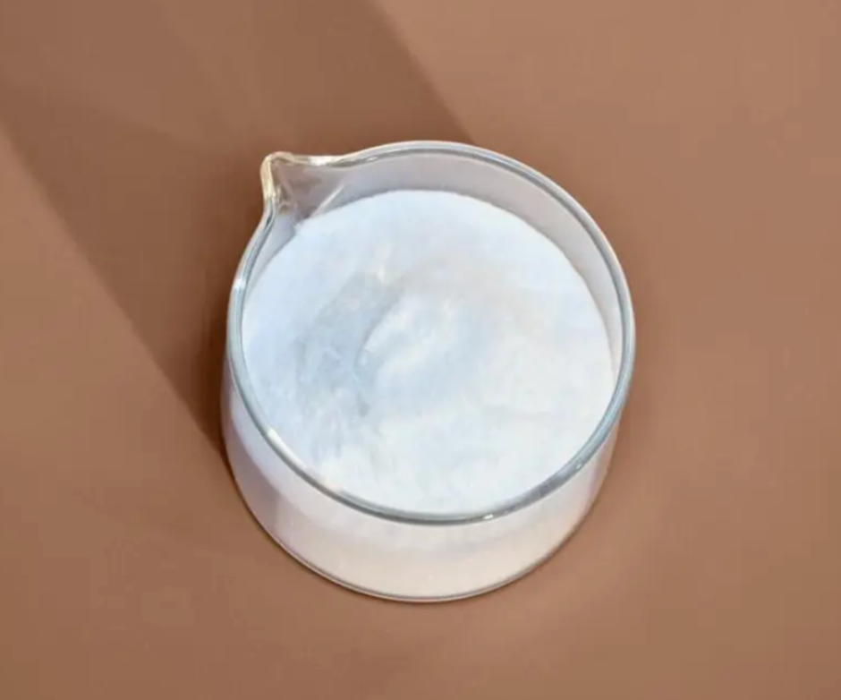 White ceramic teapot with a lid on a brown background